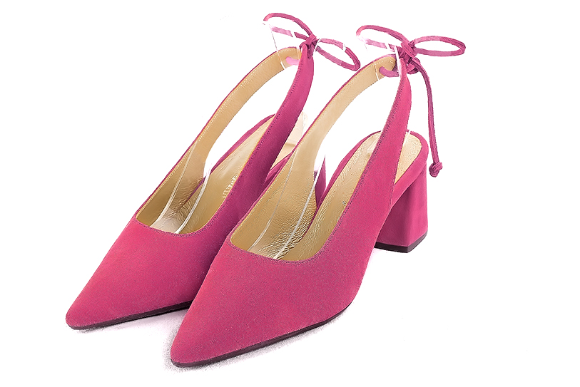 Fuschia pink slingback shoes. Pointed toe. Medium flare heels